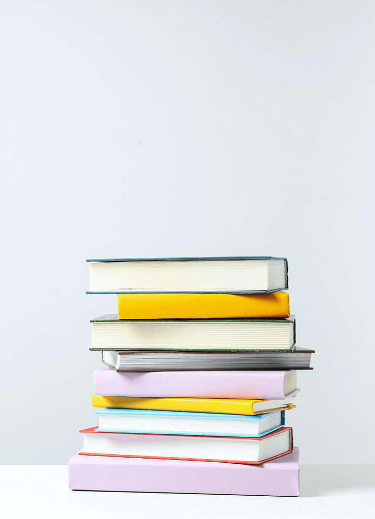 stack of multicoloured books