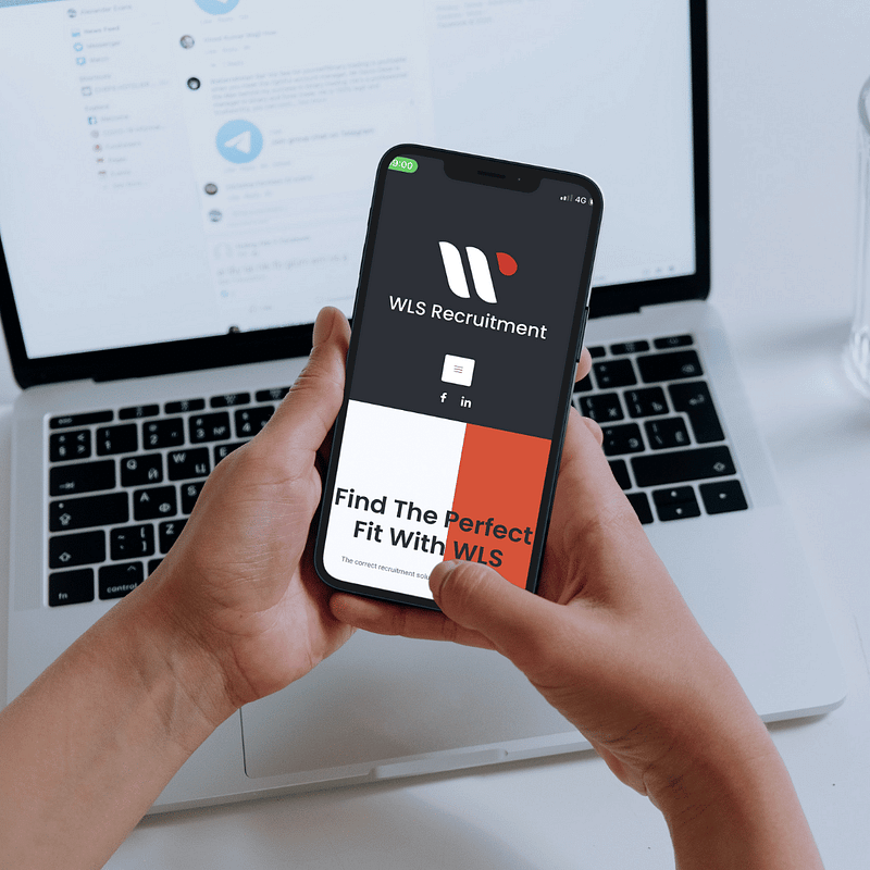 iPhone with screenshot of WLS Recruitment website